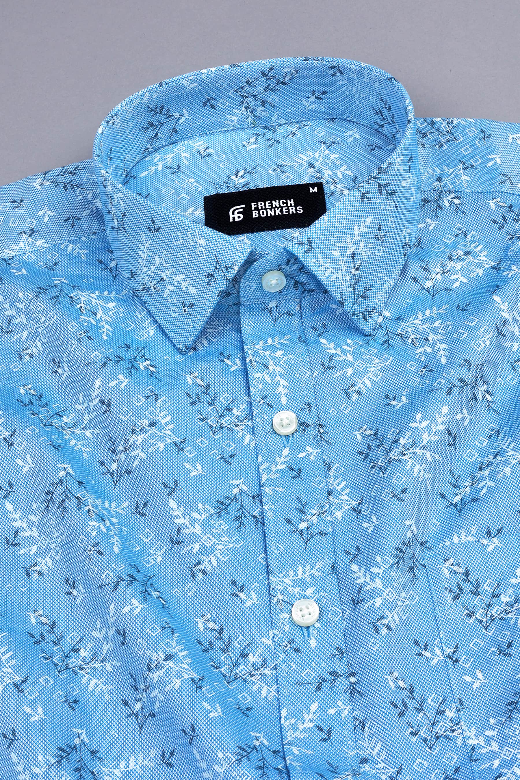 Aqua blue with black and white printed shirt