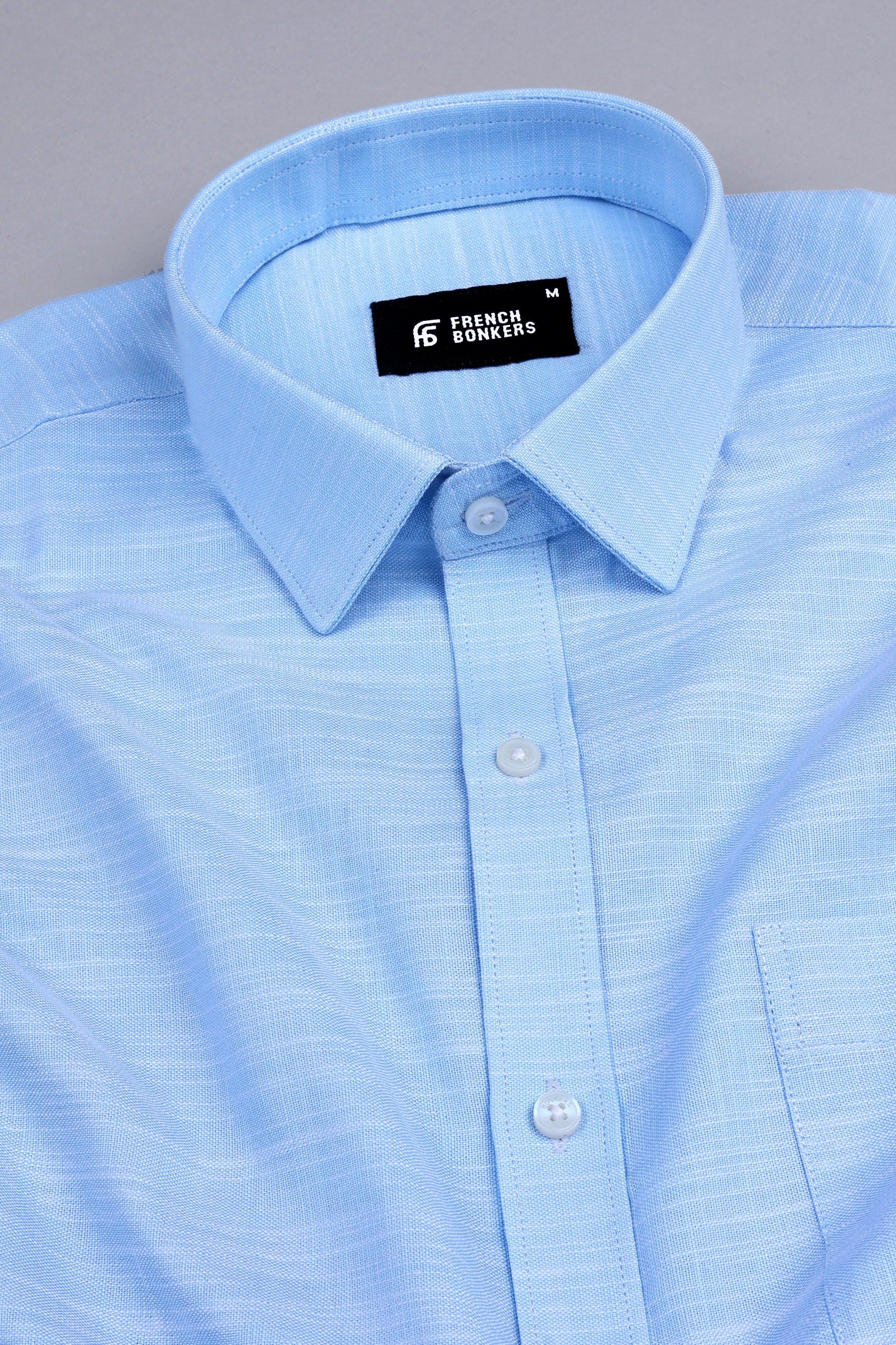 Light blue with white ruff lines solid shirt