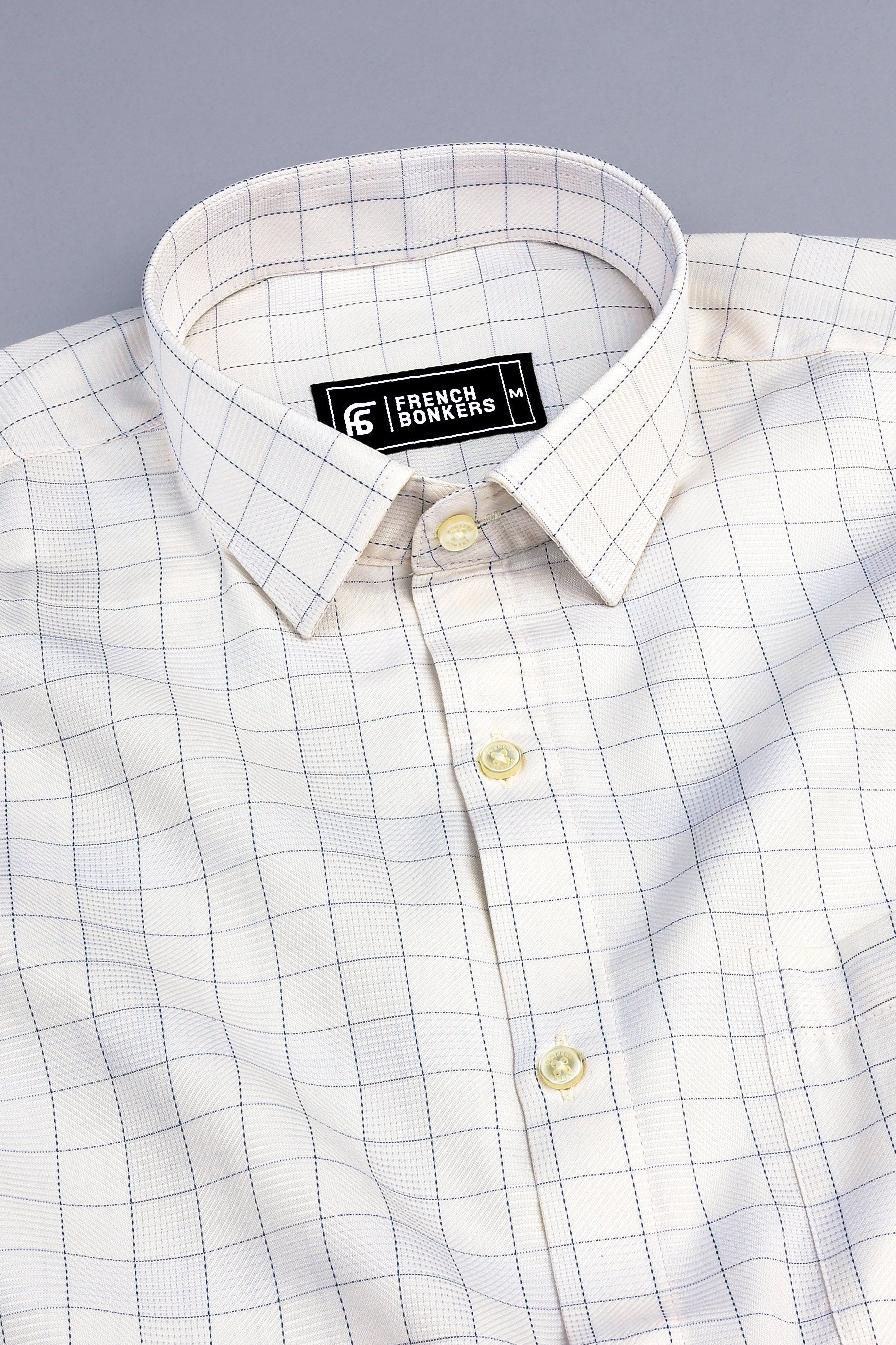 Light brown with dark blue arglye check shirt